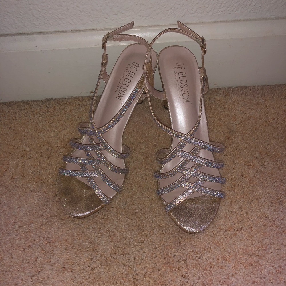 4 in gold heels w/ sliver jewels that reflect blue